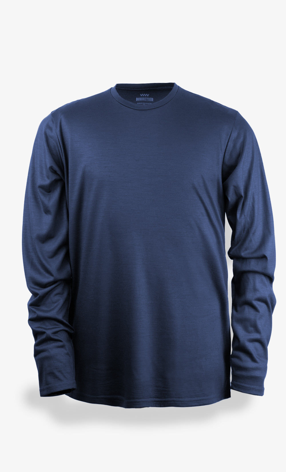Haut à manches longues en laine mérinos marine pour homme avec imprimé ours, conçu comme première couche pour les sports d’hiver.